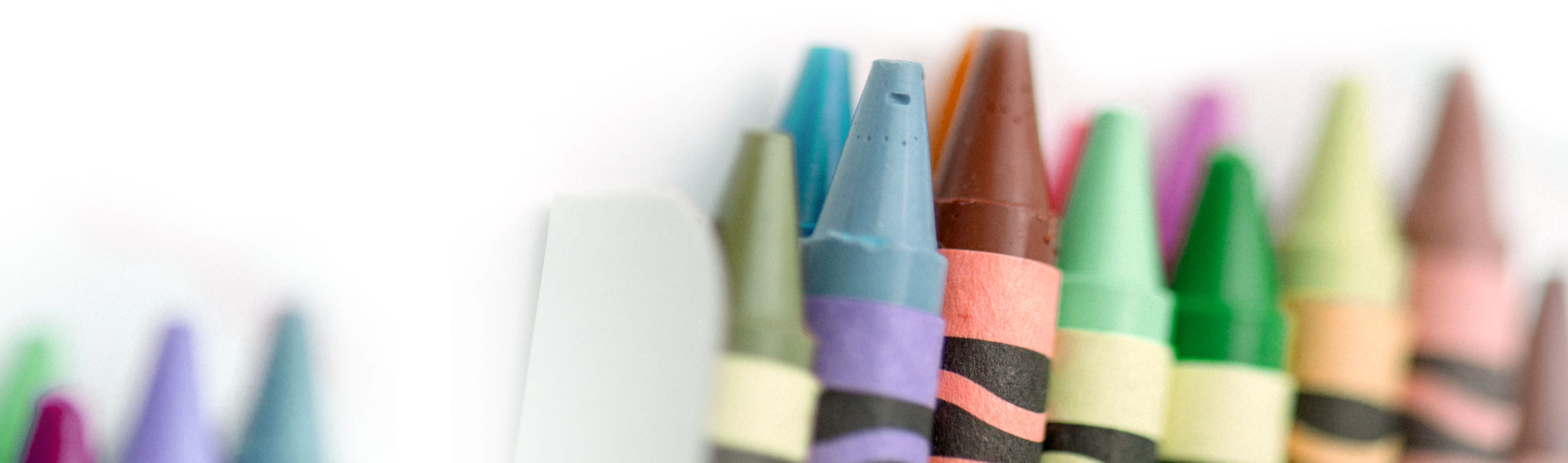 crayons in holder on white background